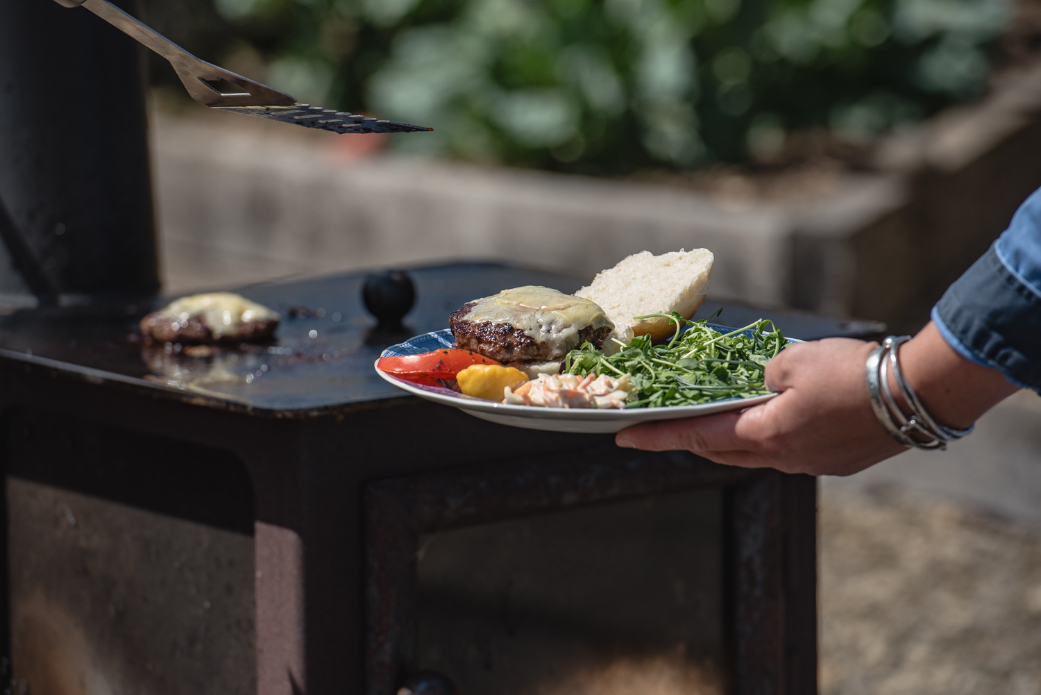 Beef burgers cooked over the firepit